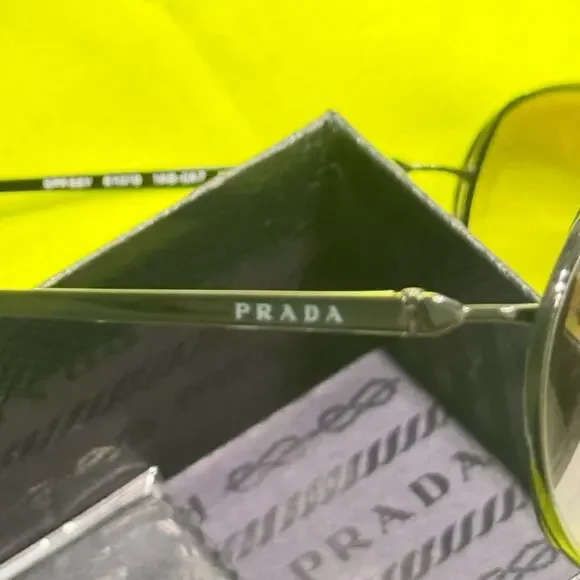 Prada 61mm Oval Sunglasses silver